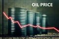 Few barrels of oil and a red graph down - decline in oil prices concept