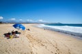 FEw beach chair in a blue sky day in the beach of Puerto Escondida in Mexico. Royalty Free Stock Photo