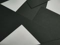 Few black papers folded with color paper close up Royalty Free Stock Photo
