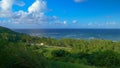 Few cars drive along the coastal road leading around the island of Barbados Royalty Free Stock Photo