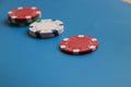 A few colorful token lying on the blue background