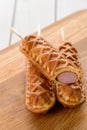 Few corn dogs on a wooden cutting board Royalty Free Stock Photo