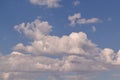 A few Cumulus clouds in a clear blue sky Royalty Free Stock Photo