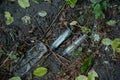 bunch of used dirty syringe leaved after drug injection lying on ground outdoor Royalty Free Stock Photo