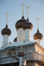 Few domes with crosses over a white-stone temple against a blue sky Royalty Free Stock Photo