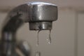 A few drops falling from a tap Royalty Free Stock Photo