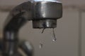 A few drops falling from a tap in kitchen Royalty Free Stock Photo