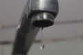A few drops falling from a tap in kitchen Royalty Free Stock Photo