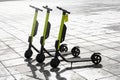 Few electric scooters parked in the sidewalk Royalty Free Stock Photo