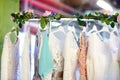 Few elegant wedding, bridesmaid ,evening, ball gown or prom dresses on a hanger in a bridal shop Royalty Free Stock Photo