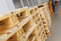 Few empty wooden pallets for storage in an empty warehouse. Royalty Free Stock Photo