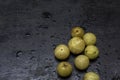 Few fresh organic gooseberries on a black background with selective focus Royalty Free Stock Photo