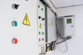 A few fuse boxes are installed on the wall in the basement. High voltage electrical control panel. Iron Electric Box Royalty Free Stock Photo