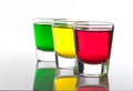 A few glasses of alcoholic drinks in red green yellow Royalty Free Stock Photo