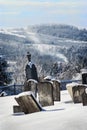 A few granite gravestones at the Grove Hill Protestant Cemetery in the Estrie on a cold winter day in Canada