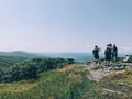 Few hikers hiking on the top of Alander Mountain