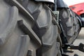 A few huge wheels from a tractor or agricultural machinery close-up.