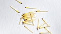 A few matches scattered on a wooden white background. Copy space Royalty Free Stock Photo