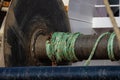 A few meters of rope on a large metal drum on a trawler.. Royalty Free Stock Photo