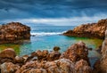 Few minutes before the storm. Dramatic summer view of volcanic beach on nature reserve Piscina di Venere, cape Milazzo, Sicily, It Royalty Free Stock Photo