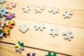 Few mockup puzzles on wooden background.