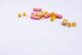 Few multi-colored pills on a light purple background Royalty Free Stock Photo