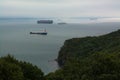 Few nautical ships in a harbor at early morning.