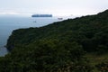 Few nautical ships in a harbor at early morning.