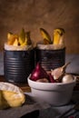 Few onions and garlics in white bowl and fried potato stripps Royalty Free Stock Photo