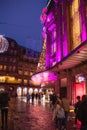 Few pedestrians walking in front of Galeries Lafayette shopping mall department