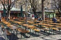 Few People in a german Biergarten Outdoor Beer Pub at the Viktualienmarkt Victuals Market in Munich during the first wave