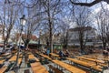 Few People in a german Biergarten Outdoor Beer Pub at the Viktualienmarkt Victuals Market in Munich during the first wave