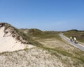 Few people on large sandy beach of german island norderney off the coast of ostfriesland under blue august sky Royalty Free Stock Photo