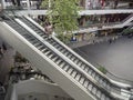 Few people using escalator during pandemic of coronavirus covid19. People wearing m