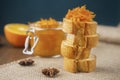 A few pieces of Franch baguette with srar anise, jar with orange confiture and a half of orange fruit Royalty Free Stock Photo