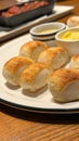 Few pieces of small bread with butter and sauce on white dish Royalty Free Stock Photo