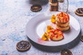 Few puff pastry donuts with strawberry topping on white plate Royalty Free Stock Photo