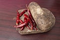 Few red Pepper on grinding stone, A traditional rock grinder to mash spices and herbs Royalty Free Stock Photo