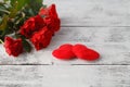 Few red roses on white table Royalty Free Stock Photo