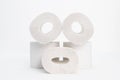 A few rolls of toilet paper in the form of a character`s face with eyes and mouth