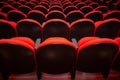 A few rows of red armchairs in an empty theater. Royalty Free Stock Photo