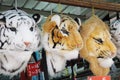 A few sling haversack bags with tigers and lion head designs on display for sale