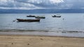 A few small fishing boats, anchored in the sea Royalty Free Stock Photo