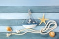 Few summer marine items on a wooden background. Royalty Free Stock Photo