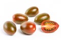 a few tomatoes on a white background with a shadow.