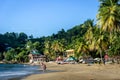 Few tourists enjoying a amazing tropical beach in the late sunset. Trinidad and Tobago, Caribe