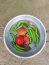 A few vegetables in a bowl on a surface Royalty Free Stock Photo