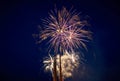 A few volleys of beautiful festive fireworks in the night sky, yellow Royalty Free Stock Photo
