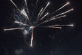 A few volleys of festive fireworks in the night sky, red-yellow. Royalty Free Stock Photo