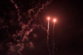 A few volleys of festive fireworks in the night sky, red-yellow. Royalty Free Stock Photo